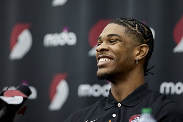 Portland Trail Blazers first round draft pick Scoot Henderson laughs during an NBA basketball news conference in Portland, Ore., Saturday, June 24, 2023. (AP Photo/Craig Mitchelldyer)