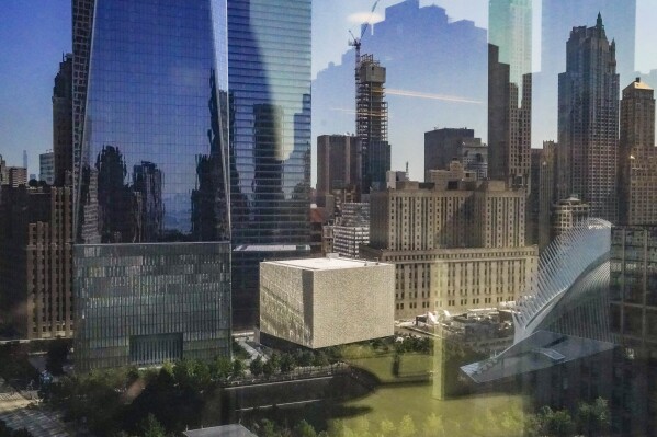 A box-shaped building, center, wrapped in translucent marble panels, is home to the new Perelman Performing Arts Center theater complex on the grounds of the World Trade Center, Wednesday Sept. 6, 2023, in New York. (AP Photo/Bebeto Matthews)