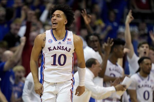 Kansas forward Jalen Wilson (10) celebrates after making a basket during the second half of an NCAA college basketball game against Oklahoma State Saturday, Dec. 31, 2022, in Lawrence, Kan. Kansas won 69-67. (AP Photo/Charlie Riedel)