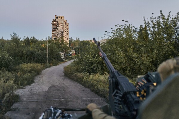 FILE - A Ukrainian soldier sits in his position in Avdiivka, Donetsk region, Ukraine, on Aug. 18, 2023. Ukrainian troops are under intense pressure from a determined Russian effort to storm the strategically important eastern Ukraine city of Avdiivka, officials say. Kyiv鈥檚 army is struggling with ammunition shortages as the Kremlin鈥檚 forces pursue a battlefield triumph around the two-year anniversary of Moscow鈥檚 full-scale invasion and ahead of a March presidential election in Russia. (APPhoto/Libkos, File)