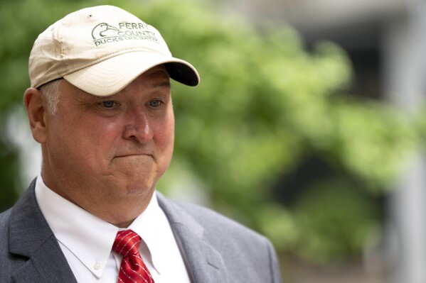 Former Ohio House Speaker Larry Householder walks to the Potter Stewart Federal Courthouse for his sentencing hearing, Thursday, June 29, 2023, in Cincinnati. Householder was sentenced to 20 years in prison, plus one year of probation, for his role in the largest corruption scandal in state history. (Albert Cesare/The Cincinnati Enquirer via AP)