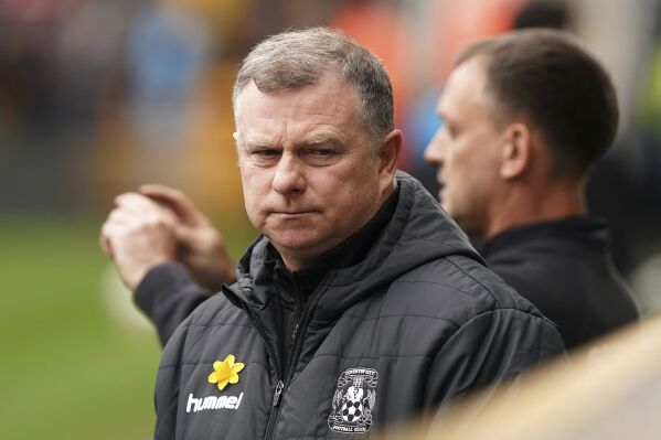 Coventry City manager Mark Robins looks on before the English FA Cup quarterfinal match soccer match between Wolverhampton and Coventry City, at the Molineux, Wolverhampton, England, Saturday, March 16, 2024. (Mike Egerton/PA via AP)