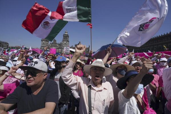 Anti-government demonstrators shout slogans against Mexican President Andres Manuel Lopez Obrador, during a march against recent reforms to the country's electoral law that they say threaten democracy, in Mexico City's main square, The Zocalo, Sunday, Feb. 26, 2023. (AP Photo/Fernando Llano)