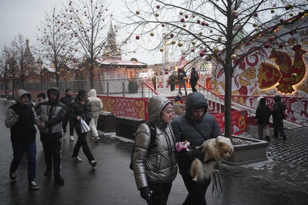 People walk on the Red square in Moscow, Russia. Thursday, Feb. 13, 2025. (AP Photo/Pavel Bednyakov)