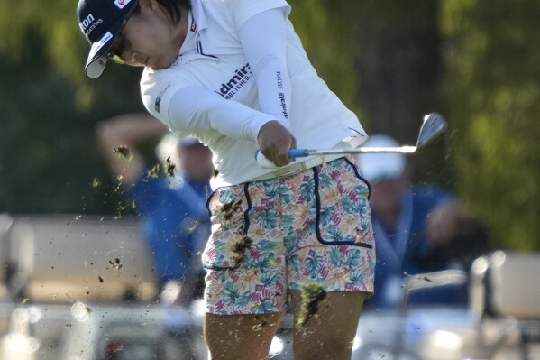 Nasa Hataoka, of Japan, hits from the 13th fairway during the third round of the LPGA CME Group Tour Championship golf tournament, Saturday, Nov. 18, 2023, in Naples, Fla. (AP Photo/Lynne Sladky)