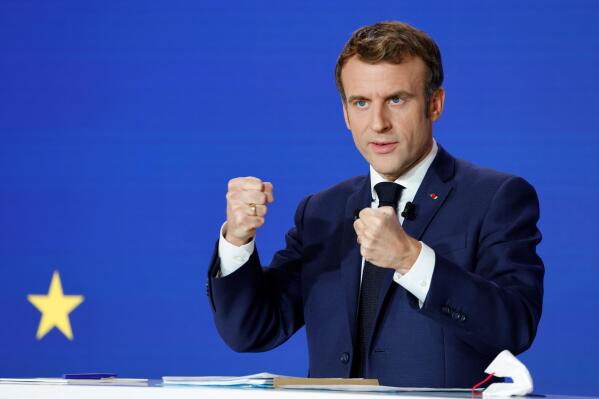 French President Emmanuel Macron delivers a speech during a press conference on France assuming EU presidency, Thursday, Dec. 9, 2021. French President Emmanuel Macron presents the priorities for France's upcoming presidency of the European Union, a tenure that overlaps with the country's presidential election and could put Macron in a tricky position if he campaigns for reelection. Macron is expected to run in April's two-round election, and France's turn in the European Council's rotating six-month presidency starts Jan. 1. 2022. (Ludovic Marin/Pool Photo via AP)