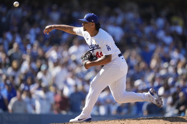 Los Angeles Dodgers relief pitcher Brusdar Graterol (48) throws during the ninth inning of a baseball game against the Atlanta Braves in Los Angeles, Sunday, Sept. 3, 2023. (AP Photo/Ashley Landis)