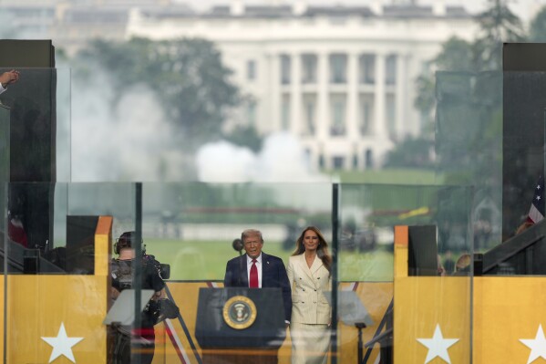 President Donald Trump and first lady Melania Trump arrive for a military parade commemorating the Army's 250th anniversary, coinciding with his 79th birthday, Saturday, June 14, 2025, in Washington. (AP Photo/Julia Demaree Nikhinson)