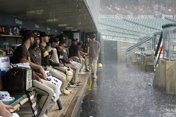 Jackson Wolf works through rain delay, wins MLB debut as Padres