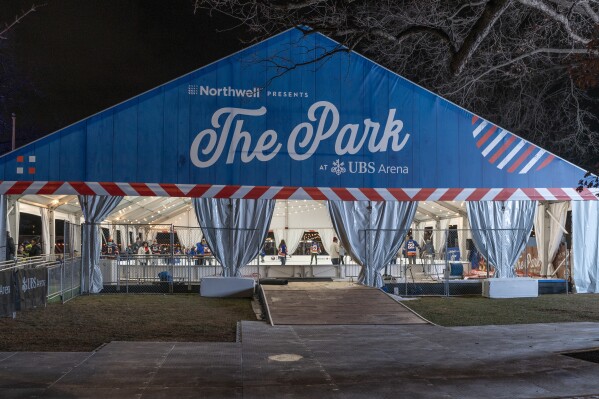 A tent covers one of two new rinks at the grand opening of The Park at UBS Arena in Elmont, N.Y., Friday, Dec. 29, 2023. (AP Photo/Peter K. Afriyie)