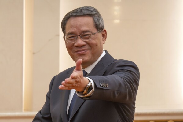 FILE - Chinese Premier Li Qiang attends a meeting with Asian Development Bank (ADB) President Masatsugu Asakawa, unseen, at the Great Hall of the People in Beijing, on July 11, 2023. Chinese President Xi Jinping is apparently skipping this week’s Group of 20 summit in India as bilateral relations remain icy. Instead, Premier Li Qiang will represent China at the Sept. 9-10 gathering, the Foreign Ministry said Monday, Sept. 4, 2023. (AP Photo/Mark Schiefelbein, Pool, File)