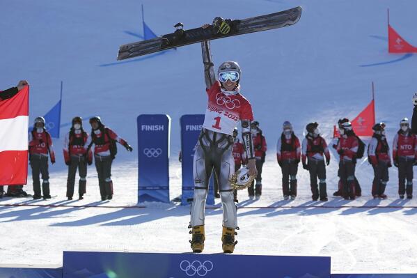 Gold medalist Czech Republic's Ester Ledecka celebrates during the venue ceremony for the women's parallel giant slalom at the 2022 Winter Olympics, Tuesday, Feb. 8, 2022, in Zhangjiakou, China. (AP Photo/Gregory Bull)