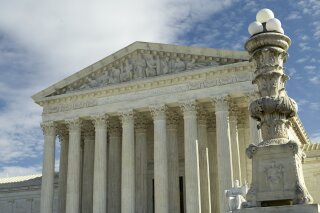 FILE - This is a Jan. 27, 2020 file photo of The Supreme Court in Washington. The Supreme Court said Monday it will hear a dispute over a Philadelphia Catholic agency that won't place foster children with same-sex couples. The justices will review an appeals court ruling that upheld the city's decision to stop placing children with the Archdiocese of Philadelphia's agency because it would not permit same-sex couples to serve as foster parents. (AP Photo/Mark Tenally)