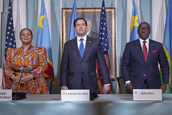 Secretary of State Marco Rubio hosts a signing ceremony in which Congo's Foreign Minister Therese Kayikwamba Wagner, left, and Rwanda's Foreign Minister Olivier Nduhungirehe, right, pledge to work toward a peace deal at the State Department in Washington, April 25, 2025. (AP Photo/Jacquelyn Martin, File)