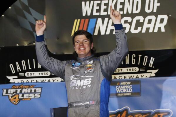Sheldon Creed celebrates in Victory Lane after winning the NASCAR Truck Series auto race at Darlington Raceway, Friday, May 7, 2021, in Darlington, S.C. (AP Photo/Terry Renna)
