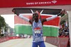 Kenya's Kelvin Kiptum celebrates his Chicago Marathon world record victory on Sunday, October 8, 2023 at Grant Park in Chicago.  (Eileen T. Messler/Chicago Tribune, via AP)
