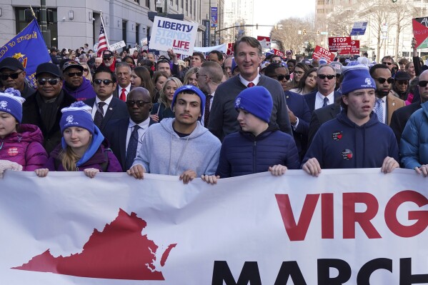 Virginia's Republican Gov. Glenn Youngkin, top center, walks with demonstrators during an anti-abortion demonstration at the March for Life event, Wednesday, Feb. 21, 2024, in Richmond, Va. (AP Photo/Jay Paul)