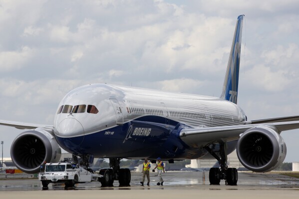 FILE - Boeing employees walk the new Boeing 787-10 Dreamliner down towards the delivery ramp area at the company's facility after conducting its first test flight at Charleston International Airport, Friday, March 31, 2017, in North Charleston, S.C. A Senate subcommittee has opened an investigation into the safety of Boeing jetliners, intensifying safety concerns about the company’s aircraft. The panel has summoned Boeing's CEO, Dave Calhoun, to a hearing next week where a company engineer, Sam Salehpour, is expected to detail safety concerns about the manufacture and assembly of Boeing’s 787 Dreamliner. (AP Photo/Mic Smith, File)