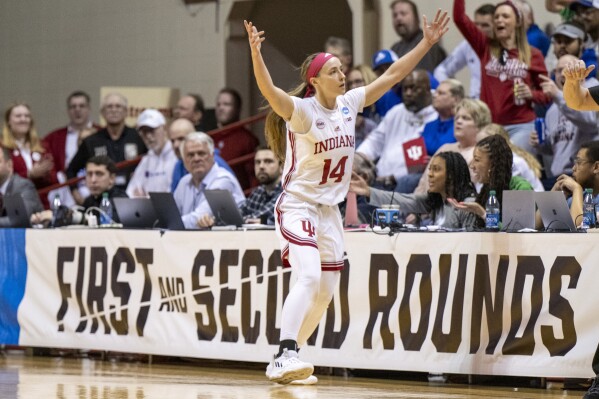 Indiana guard Sara Scalia (14) reacts after scoring a 3-point field goal during the second half of a first-round college basketball game against Fairfield in the NCAA Tournament, Saturday, March 23, 2024, in Bloomington, Ind. (AP Photo/Doug McSchooler)