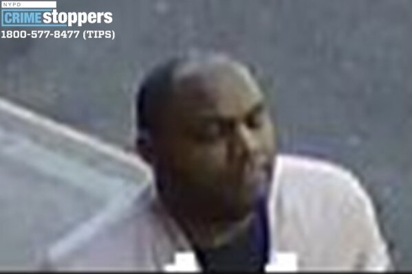 This image taken from surveillance video provided by the New York City Police Department shows a person of interest in connection with an assault of an Asian American woman, Monday, March 29, 2021, in New York. The NYPD is asking for the public's assistance in identifying the man. (Courtesy of New York Police Department via AP)