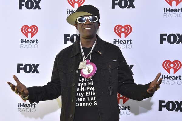 FILE - Flavor Flav arrives at the iHeartRadio Music Awards on Monday, April 1, 2024, in Los Angeles. Maggie Steffens asked for more support for the U.S. women's water polo team, and the captain received one particularly surprising response. From a clock-wearing rap icon.(Photo by Jordan Strauss/Invision/Ǻ, File)