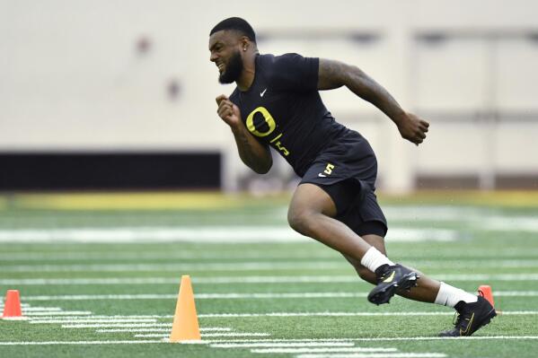 Oregon's Kayvon Thibodeaux participates in a drill during Oregon's football pro day Friday, April 1, 2022, in Eugene, Ore. (AP Photo/Andy Nelson)