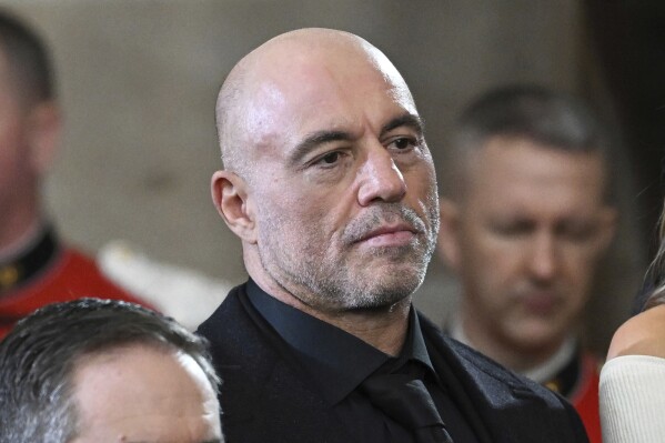 Joe Rogan stands for a benediction after President Donald Trump was sworn in during the 60th Presidential Inauguration in the Rotunda of the U.S. Capitol in Washington, Jan. 20, 2025. (Saul Loeb/Pool photo via AP, File)