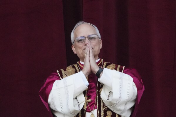 Newly elected Pope Leo XIV appears at the balcony of St. Peter's Basilica at the Vatican, Thursday, May 8, 2025. (AP Photo/Alessandra Tarantino)