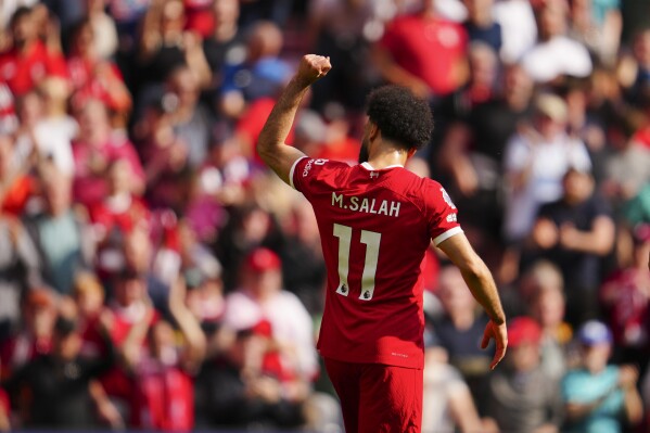 Liverpool's Mohamed Salah celebrates scoring his side's opening goal during the English Premier League soccer match between Liverpool and Tottenham Hotspur at Anfield Stadium in Liverpool, England, Sunday, May 5, 2024. (AP Photo/Jon Super)