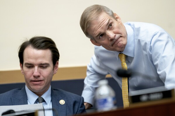 Rep. Kevin Kiley, R-Calif., left, and Rep. Jim Jordan, R-Ohio, chairman of the House Judiciary Committee, talk during a hearing of the House Judiciary Committee with Special Counsel Robert Hur in the Rayburn Office Building on Capitol Hill in Washington, Tuesday, March 12, 2024. (AP Photo/Nathan Howard)
