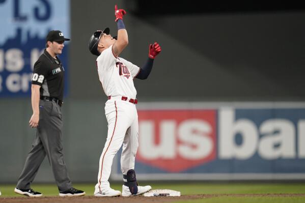 Minnesota Twins' Gio Urshela celebrates after hitting a three-run double during the fifth inning of a baseball game against the Boston Red Sox, Monday, Aug. 29, 2022, in Minneapolis. (AP Photo/Abbie Parr)