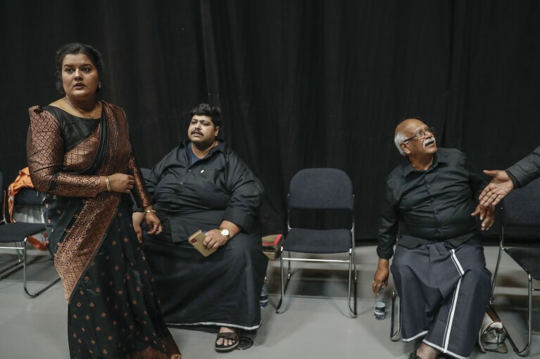 The Danish family of Velupillai Prabhakaran, founder of the Liberation Tigers of Tamil Eelam (LTTE), also known as the Tamil Tigers, attend a memorial service at the DGI Huset Conference Center in Vejle, Denmark, May 18, 2024. Members of the Tamil diaspora from across Europe gathered to remember Prabhakaran 15 years after the end of Sri Lanka's civil war, which pitted Sri Lankan government forces against Tamil Tiger separatists. (AP Photo/Nat Castañeda)