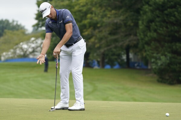 Justin Thomas reacts to missing a birdie putt on the first hole during the second round of the Wyndham Championship golf tournament in Greensboro, N.C., Friday, Aug. 4, 2023. (AP Photo/Chuck Burton)