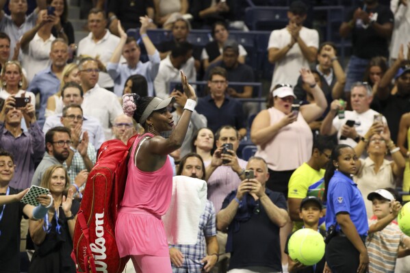 Venus Williams, of the United States, waves as she departs after losing to Greet Minnen, of Belgium, during the first round of the U.S. Open tennis championships, Tuesday, Aug. 29, 2023, in New York. (AP Photo/Jason DeCrow)