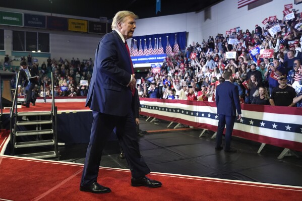 Republican presidential candidate former President Donald Trump walks off the stage after speaking at a Get Out The Vote rally at Coastal Carolina University in Conway, S.C., Saturday, Feb. 10, 2024. (AP Photo/Manuel Balce Ceneta)