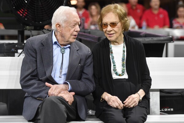 FILE - In this Sept. 30, 2018, file photo former President Jimmy Carter and Rosalynn Carter are seen ahead of an NFL football game between the Atlanta Falcons and the Cincinnati Bengals in Atlanta. Jimmy and Rosalynn Carter have been best friends and life mates for nearly 80 years. Now with the former first lady's death at age 96, the former president must adjust to life without the woman who he credits as his equal partner in everything he accomplished in politics and as a global humanitarian after their White House years. (AP Photo/John Amis, File)