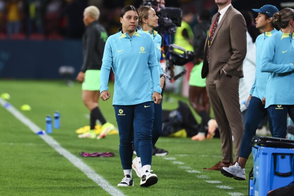Australian captain Sam Kerr walks along the side line before the Women's World Cup Group B soccer match between Australia and Nigeria In Brisbane, Australia, Thursday, July 27, 2023. (AP Photo/Tertius Pickard)