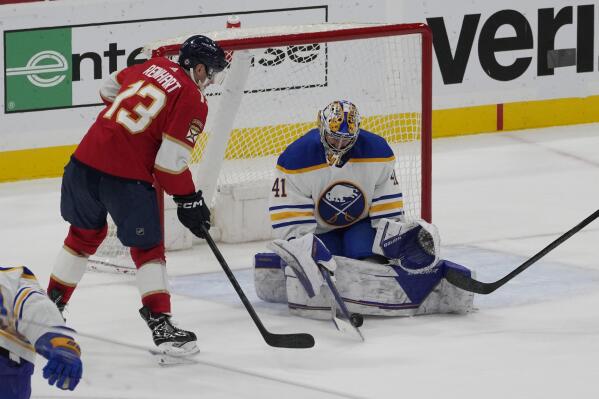 Buffalo Sabres goaltender Craig Anderson (41) stops a shot on goal by Florida Panthers center Sam Reinhart (13) during the third period of an NHL hockey game, Friday, Feb. 24, 2023, in Sunrise, Fla. The Sabres defeated the Panthers 3-1. (AP Photo/Marta Lavandier)