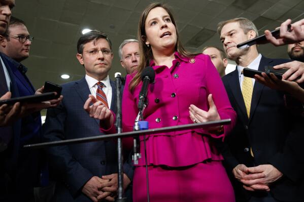 FILE - In this Jan. 23, 2020, file photo Rep. Elise Stefanik, R-N.Y., center, accompanied by from left, Rep. Mike Johnson, R-La., Rep. Mark Meadows, R-N.C., Rep. Lee Zeldin, R-N.Y. and Rep. Jim Jordan, R-Ohio, speaks to the media before the impeachment trial of President Donald Trump on Capitol Hill in Washington. Conservatives in and out of Congress are expressing opposition to Stefanik’s rise toward House Republicans' No. 3 leadership job. House Republicans plan to meet privately next week, and seem certain to oust Rep. Liz Cheney, R-Wyo., from that top post. (AP Photo/ Jacquelyn Martin, File)