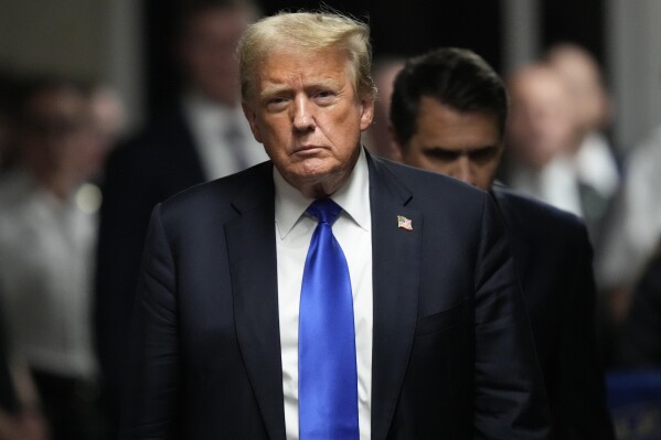 Former President Donald Trump walks to make comments to members of the media after a jury convicted him of felony crimes for falsifying business records in a scheme to illegally influence the 2016 election, at Manhattan Criminal Court, Thursday, May 30, 2024, in New York. (AP Photo/Seth Wenig, Pool)