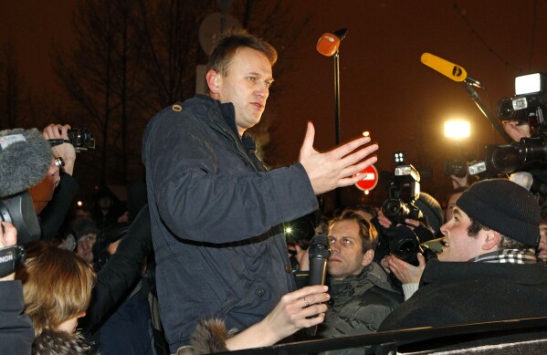 FILE - Alexei Navalny speaks to journalists after being released from a police custody on the outskirts of Moscow early Wednesday, Dec. 21, 2011. Russian authorities on Friday, Feb. 16, 2023, say Navalny, the fiercest foe of Russian President Vladimir Putin who crusaded against official corruption and staged massive anti-Kremlin protests, died in prison. He was 47. (AP Photo/Mikhail Metzel, File)