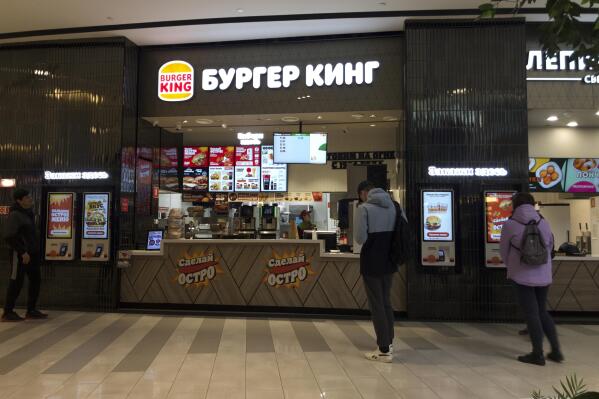 A Burger King kiosk is seen at Paveletskaya Plaza shopping mall in Moscow, Russia, Wednesday, May 3, 2023. When Russia invaded Ukraine, companies were quick to respond, some announcing they would get out of Russia immediately, others vowed to curtail sales and new investment. More than a year later, it’s clear: Leaving Russia isn't as easy as the first announcements might have made it seem. (AP Photo/Alexander Zemlianichenko)