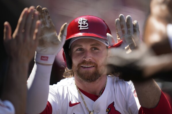 St. Louis Cardinals' Brendan Donovan is congratulated by teammates after hitting a solo home run during the sixth inning of a baseball game against the Pittsburgh Pirates Thursday, June 13, 2024, in St. Louis. (AP Photo/Jeff Roberson)