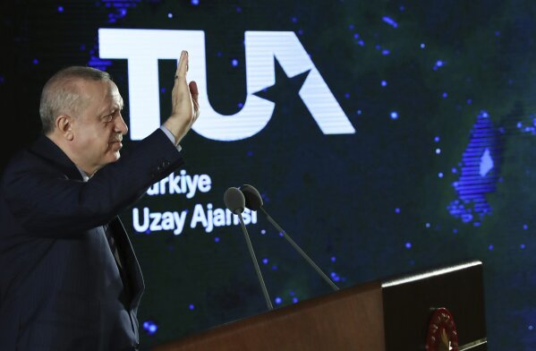 Turkish President Recep Tayyip Erdogan speaks in Ankara, Turkey, late Tuesday, Feb. 9, 2021. Erdogan unveiled Tuesday an ambitious 10-year space program for his country, including missions to the moon, sending Turkish astronauts into space and developing internationally-competent satellite systems. (Turkish Presidency via AP, Pool)