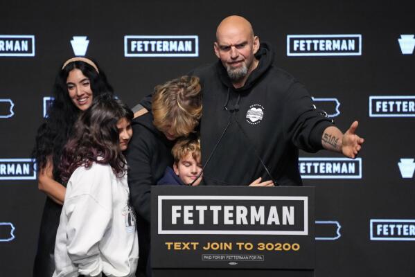 Pennsylvania Lt. Gov. John Fetterman, Democratic candidate for U.S. Senate from Pennsylvania, right, is joined by his family after addressing supporters at an election night party in Pittsburgh, Wednesday, Nov. 9, 2022. (AP Photo/Gene J. Puskar)