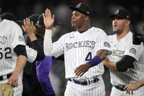 Colorado Rockies' Elehuris Montero is congratulated by teammates after the team's baseball game against the San Francisco Giants on Friday, Aug.19, 2022, in Denver. Montero hit two home runs in the game. (AP Photo/David Zalubowski)