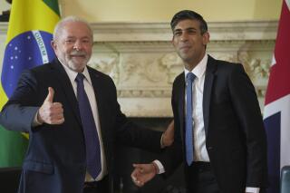 Britain's Prime Minister Rishi Sunak, right greets the President of Brazil, Lula da Silva during their meeting inside 10 Downing Street London, Friday, May 5, 2023. (AP Photo/Kin Cheung, POOL)