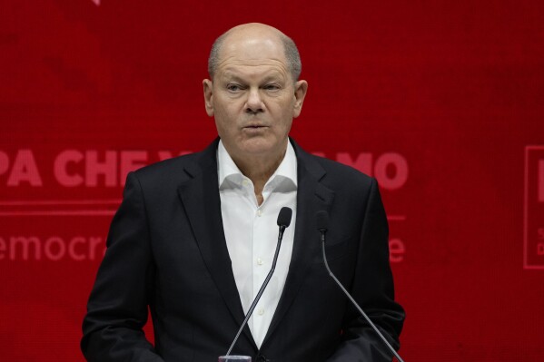German Chancellor Olaf Scholz delivers his speech at the PES congress after main candidate to the next European elections Nicolas Schmit has been elected, in Rome, Saturday, March 2, 2024. (AP Photo/Alessandra Tarantino)
