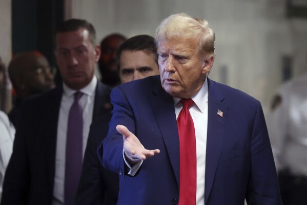 Former President Donald Trump speaks to the media at Manhattan criminal court during the continuation of his trial on Thursday, April 25, 2024, in New York. (Spencer Platt/Pool Photo via AP)