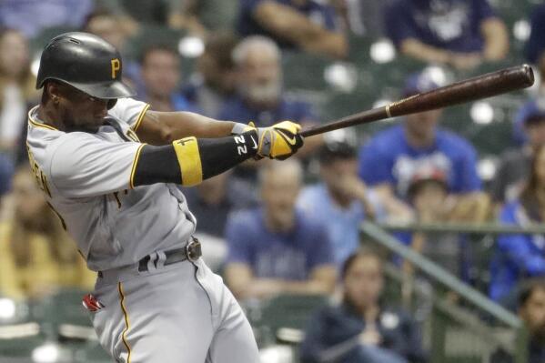 FILE - Pittsburgh Pirates' Andrew McCutchen hits his 200th career home run during the first inning of a baseball game against the Milwaukee Brewers, Wednesday, Sept. 13, 2017, in Milwaukee. McCutchen is returning to the Pirates. A person with knowledge of the agreement tells the Associated Press the veteran centerfielder, a five-time All-Star and the 2013 National League MVP for the Pirates earlier in his career, has agreed to a one-year deal with the club.(AP Photo/Morry Gash, File)
